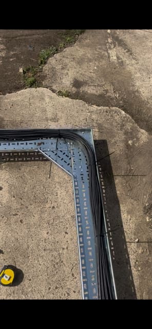 Segregated DC cabling run along a cable tray at The Old Depot