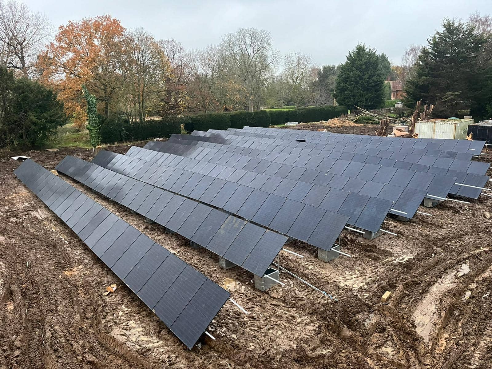 Ground-mounted solar panels installed on cleared ground at Woodhall Manor after six weeks of enabling works