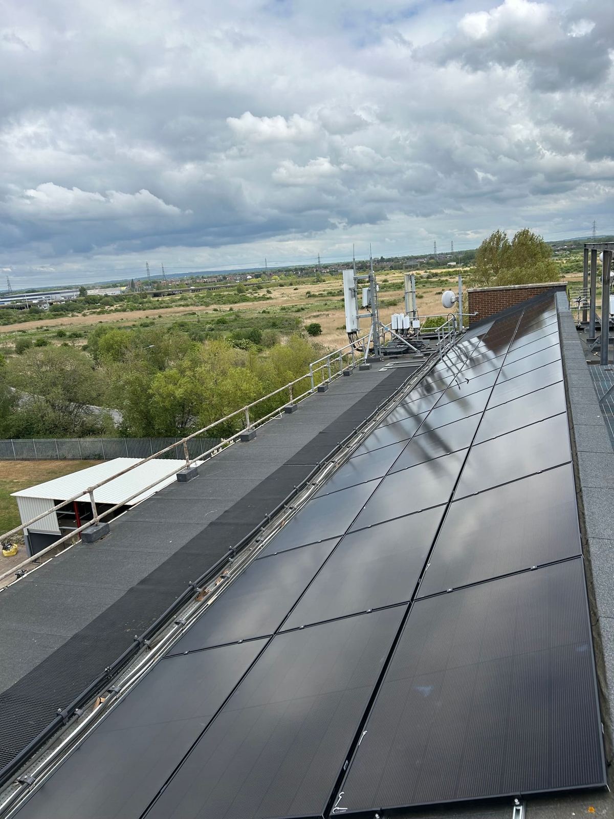 Commercial rooftop solar panel array installed by EC Eco Energy